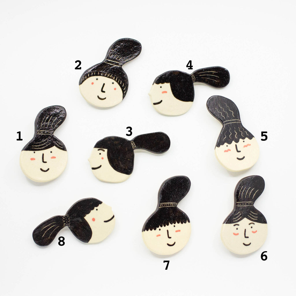 A Top View of the Ponytail collection of ceramic brooches. Numbered so you can choose your favourite. 