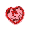 A heart-shaped pink and red patch featuring a cartoon cat face with a red bow, shown on a plain white background.