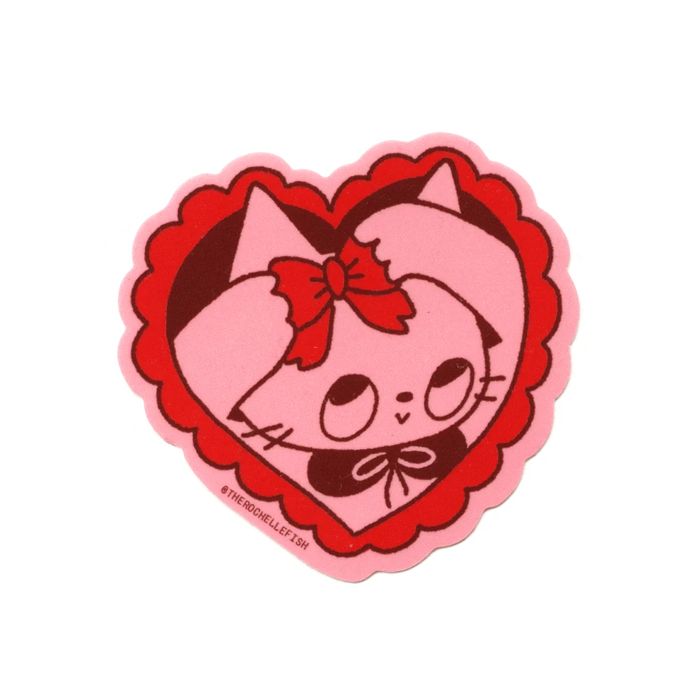 A heart-shaped pink and red patch featuring a cartoon cat face with a red bow, shown on a plain white background.