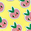 Pattern of cartoon peach magnets with faces on a yellow background