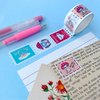 Decorative tape with cartoon design on a blue background with pens and paper.