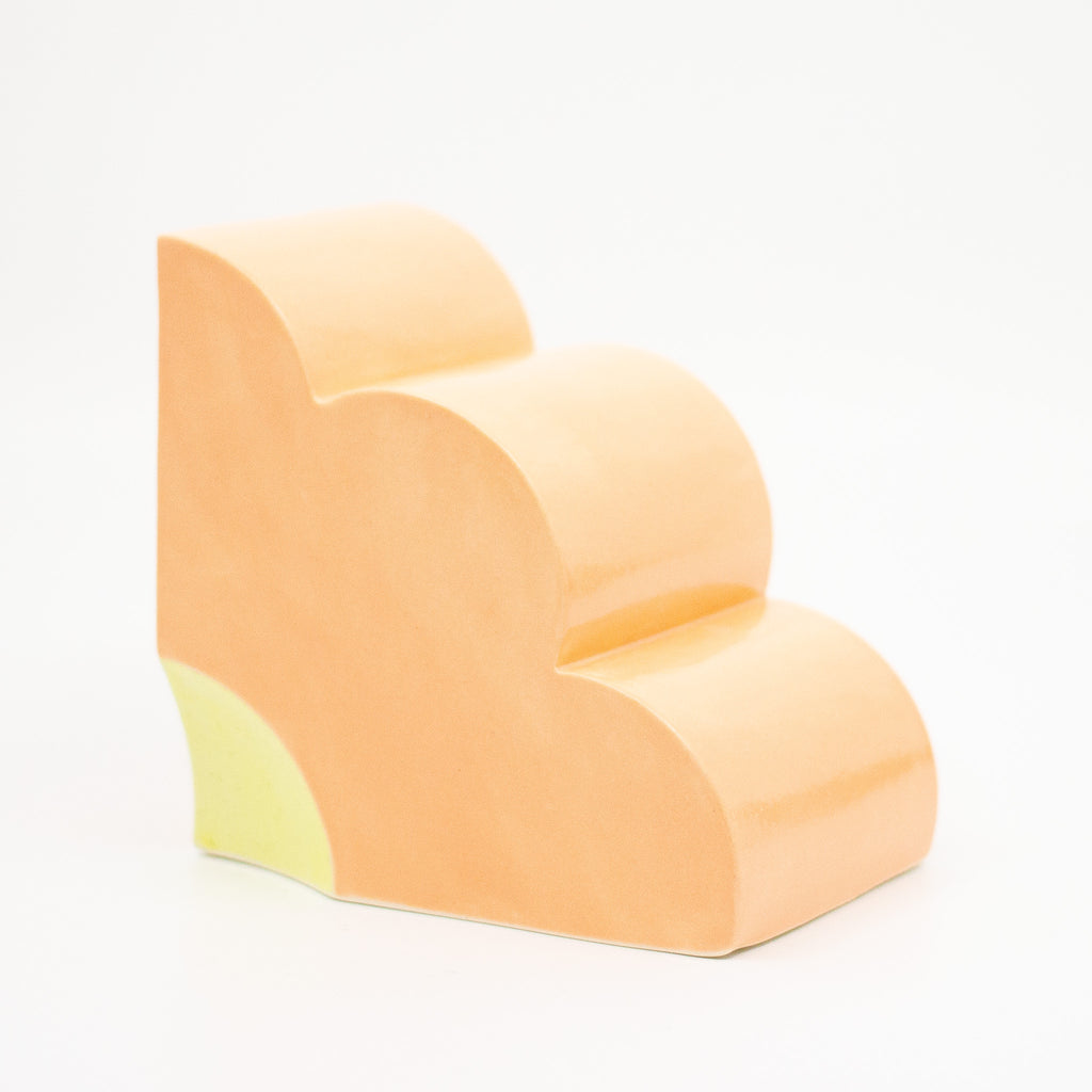 Side view of Marigold quarter flower bookend. 