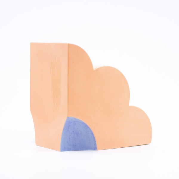 Back view of the peach coloured bookend, with blue highlight. 