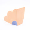 Side view of the peach coloured bookend, with blue highlight. 