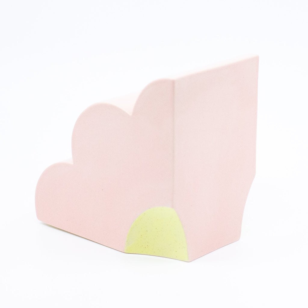 Back view of the pink bookend, with yellow highlight. 