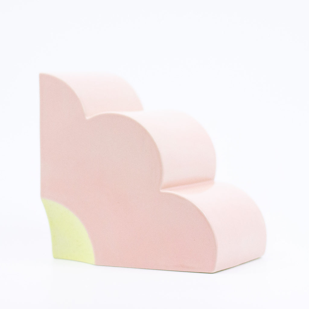 Side view of the pink bookend, with yellow highlight. 