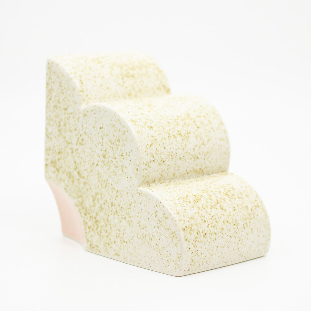 Side view of the Speckled quarter flower bookend.