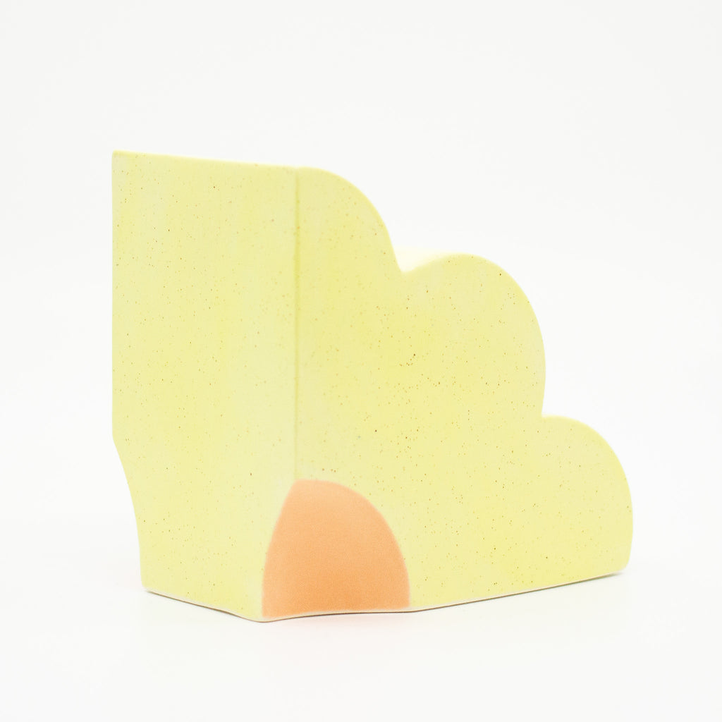 Back view of the sunny yellow quarter flower bookend. 