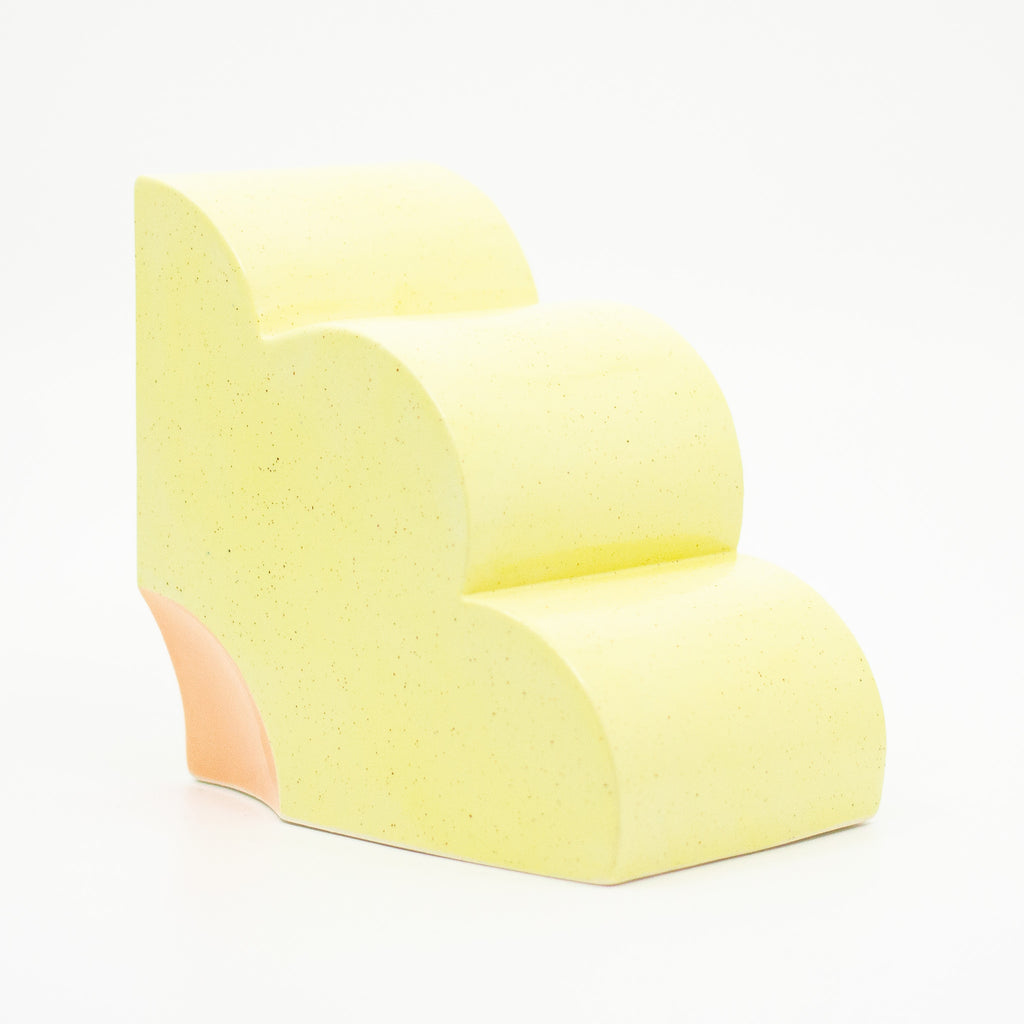 Side view of the sunny yellow quarter flower bookend. 