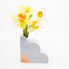 Lilac abstract vase with yellow flowers on a white background