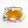 A kiss-lock clutch purse featuring a large brown rabbit illustration on a white background with a colorful floral pattern, finished with a gold-tone metal frame.