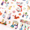 A close-up of a sticker sheet covered with colourful illustrations of rabbit and animal figures, flowers, and small woodland motifs in pastel and bright colours.