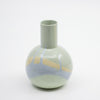 Round ceramic vase with blue, mint, and beige swirl on a white background