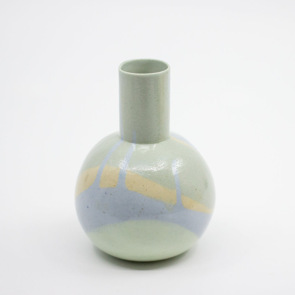 Round ceramic vase with blue, mint, and beige swirl on a white background