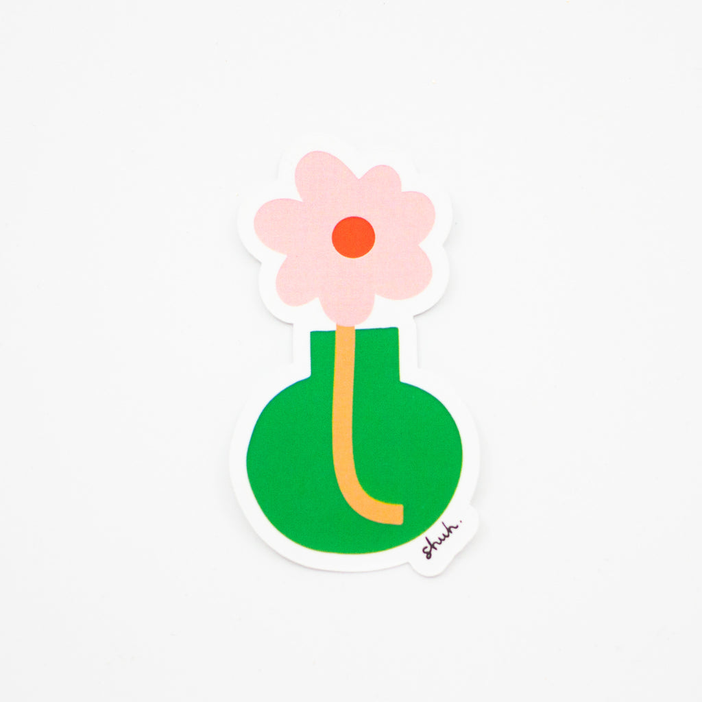 A sticker with a pink flower, and orange stem, in a green bulb vase. 