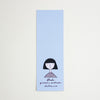 A tall, narrow light blue bookmark with a simple black line drawing of a person with a bob haircut and the text 'shuh. printed in australia shuhlee.com'