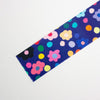 Colourful floral and polka dot pattern on a blue background