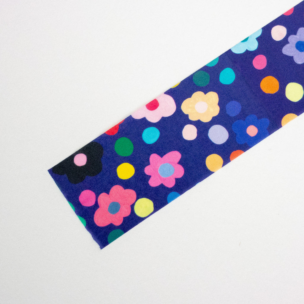 Colourful floral and polka dot pattern on a blue background
