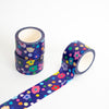 Washi tape with colourful floral and polka dot pattern on a white background