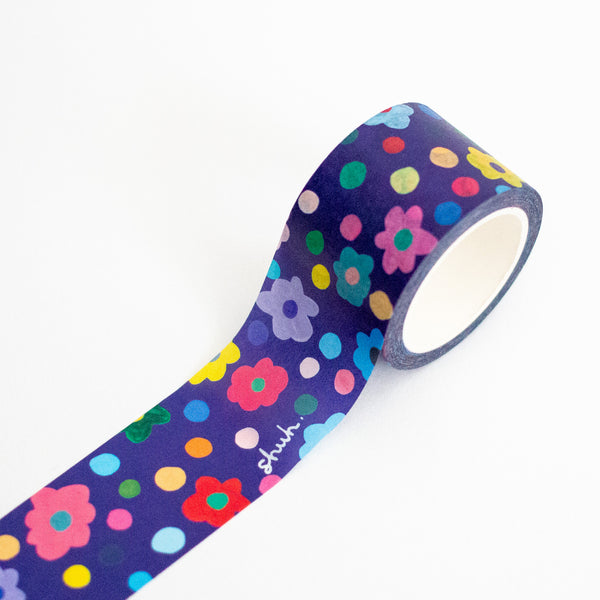 Decorative tape with colourful floral and polka dot pattern on a white background