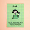 An iron-on embroidery patch shaped like a cartoon girl with a black bob haircut, a green and white striped shirt, and apeace hand sign on a green graph paper card with the word 'shuh.' at the top and text reading 'Iron-On Embroidery Patch' on a peach background.
