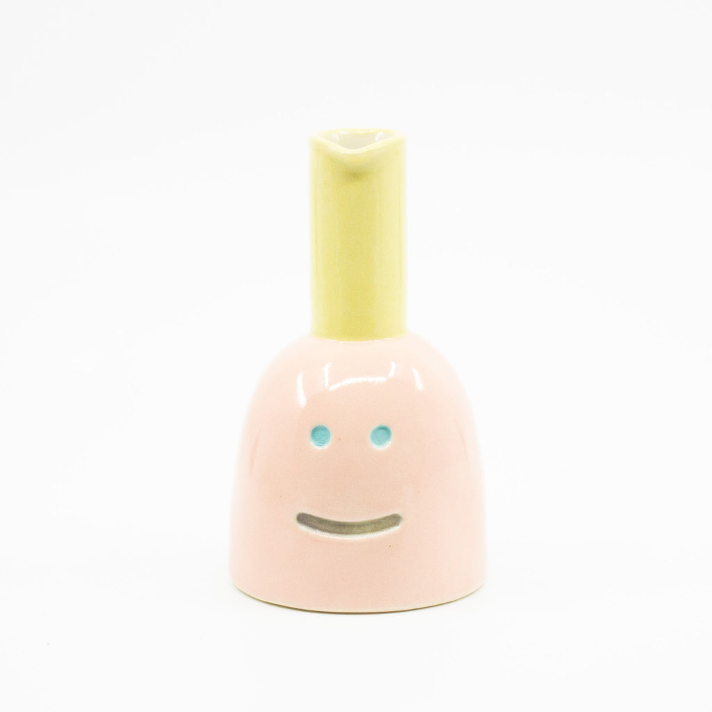 Front view of Shoyu vase. Pink colour and yellow chimney. 