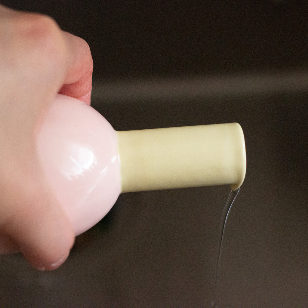Picture of Shoyu vase being used to pour water. 