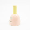 Side view of Shoyu vase. Pink colour and yellow chimney. 