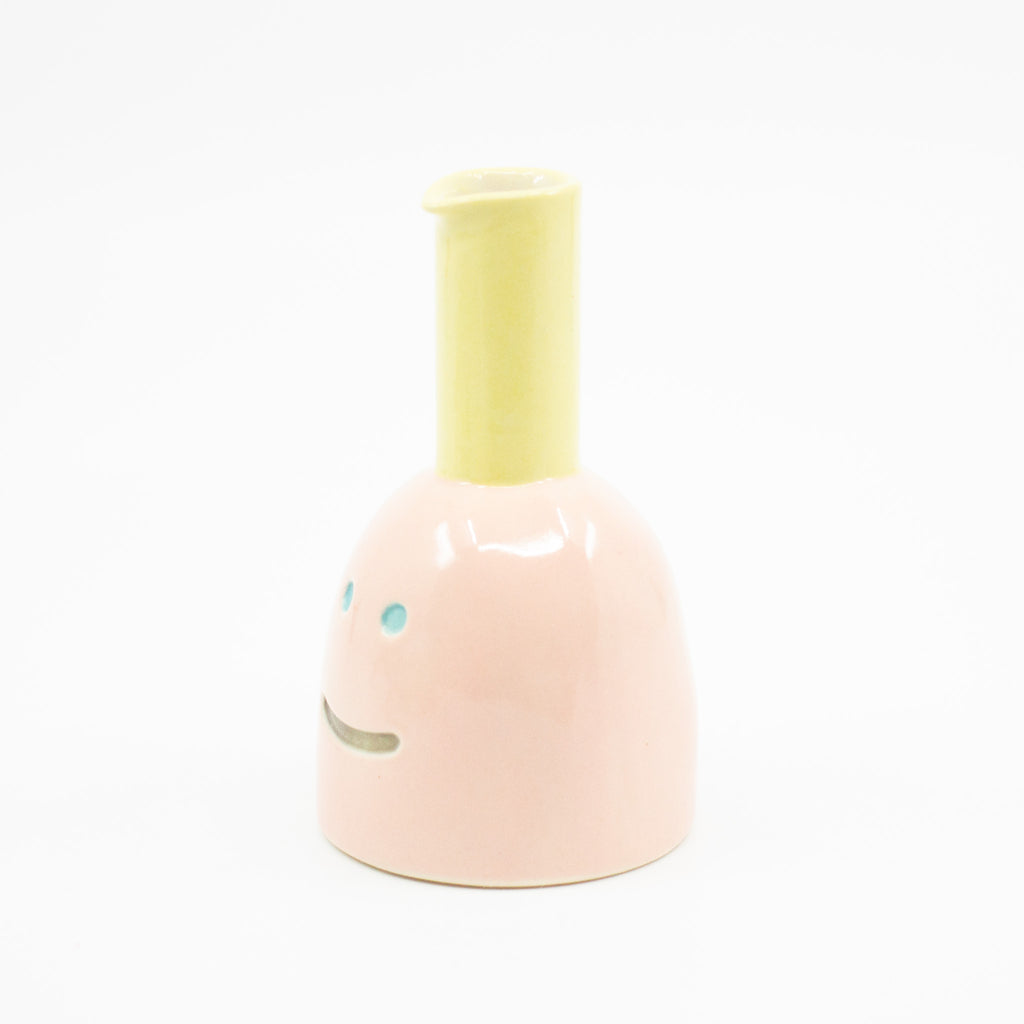 Side view of Shoyu vase. Pink colour and yellow chimney. 