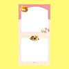A small notepad with a cute cartoon food and animal illustration.