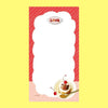 A small notepad with a cute cartoon food and animal illustration.