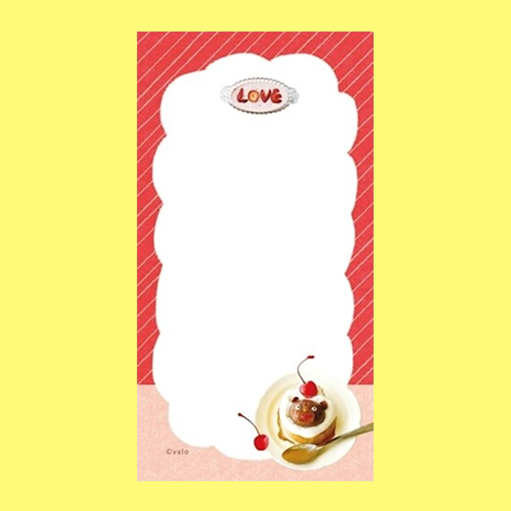 A small notepad with a cute cartoon food and animal illustration.