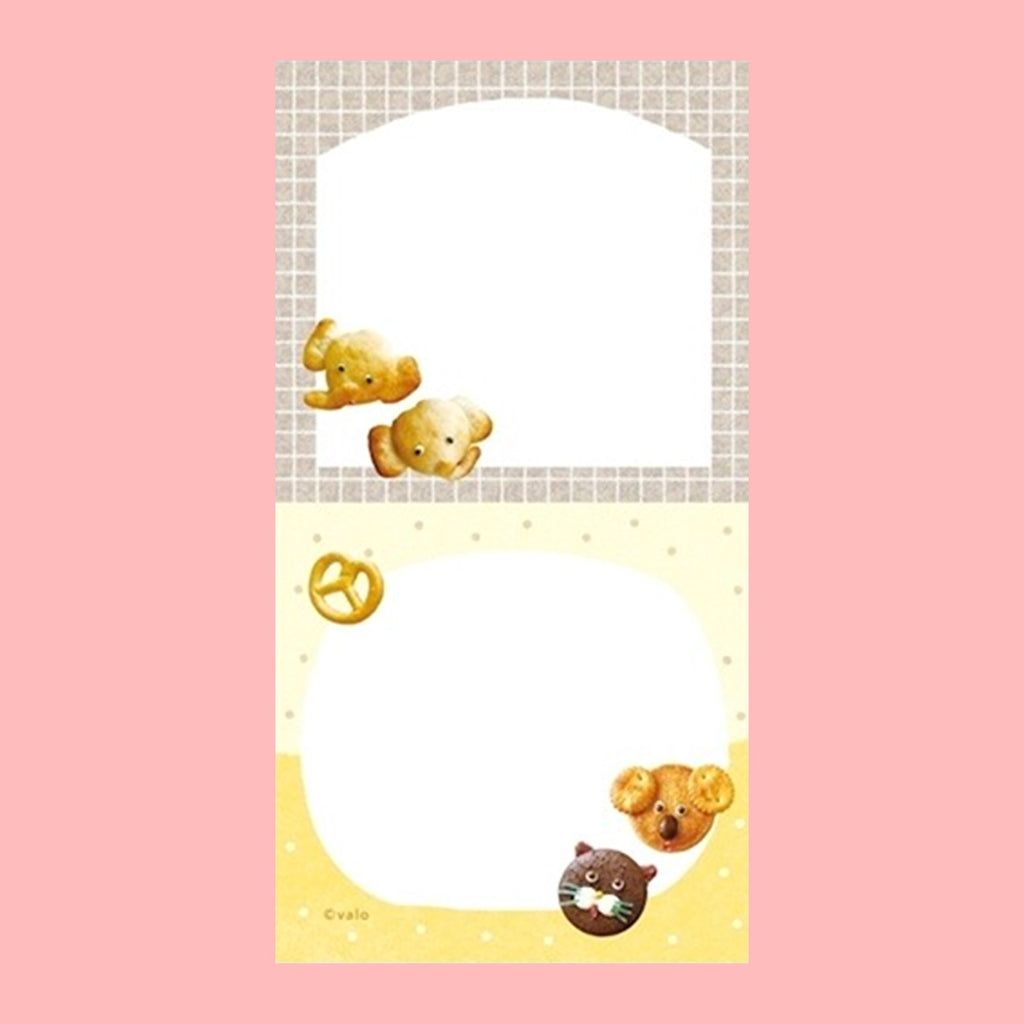 A small notepad with a cute cartoon food and animal illustration .