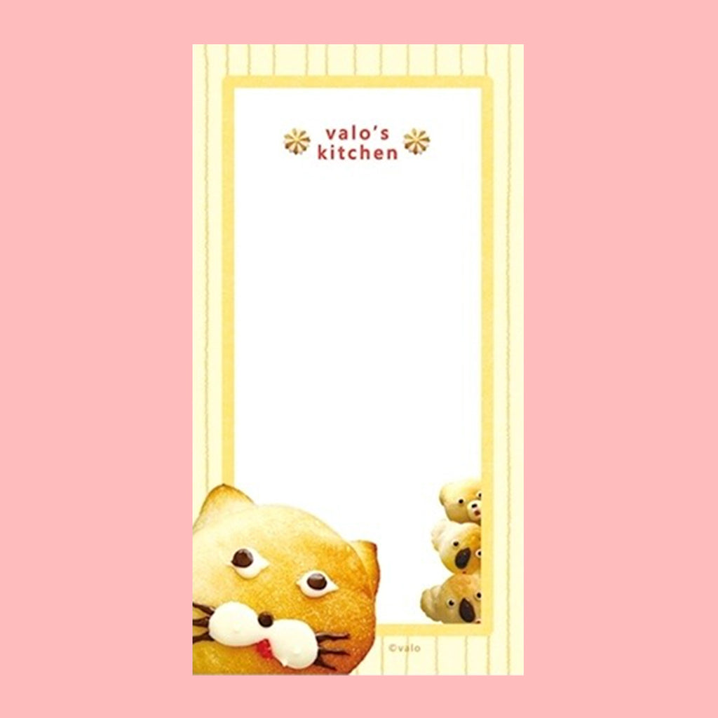 A small notepad with a cute cartoon food and animal illustration.