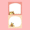 A small notepad with a cute cartoon food and animal illustration.