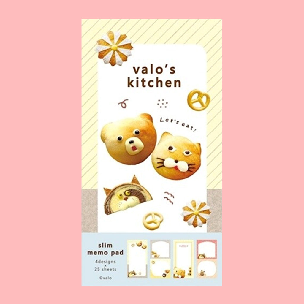 A small notepad with a cute cartoon food and animal illustration on the cover. 
