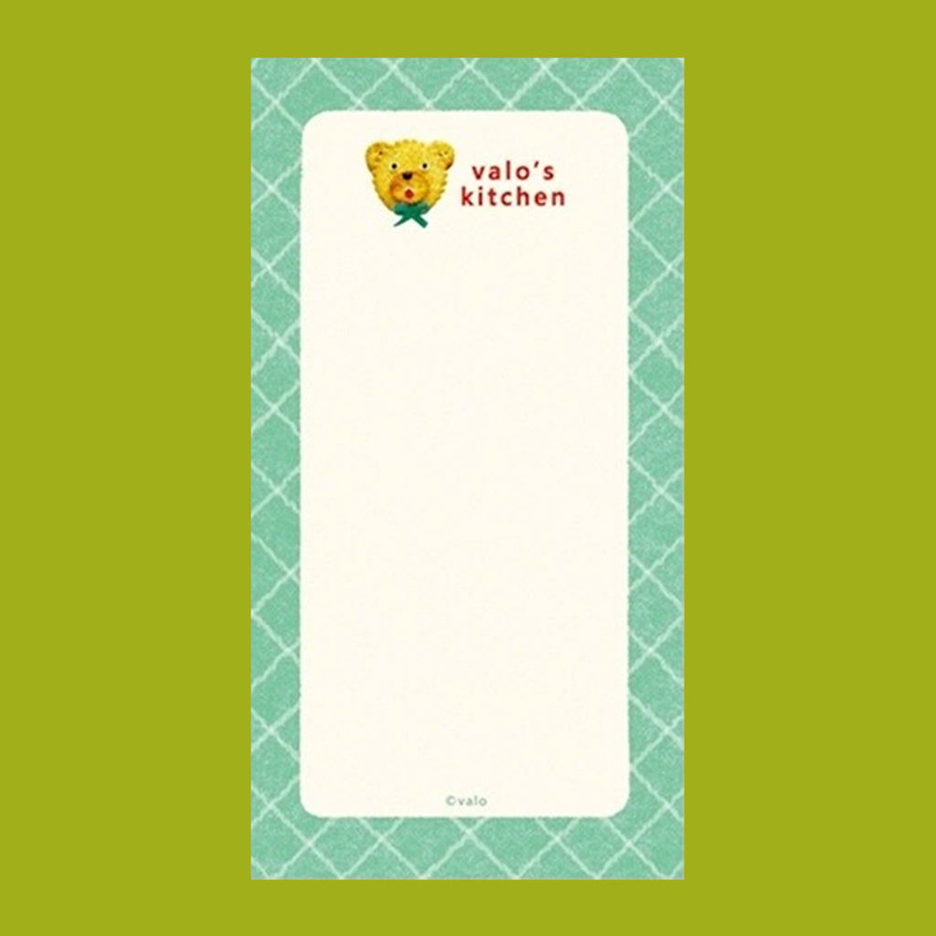 A small notepad with a cute cartoon food and animal illustration.