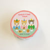 A roll of decorative tape with a round label featuring three cartoon cats wearing party hats and snacks, with the text 'snack time tape' and 'AIKO FUKAWA' on a plain white background.