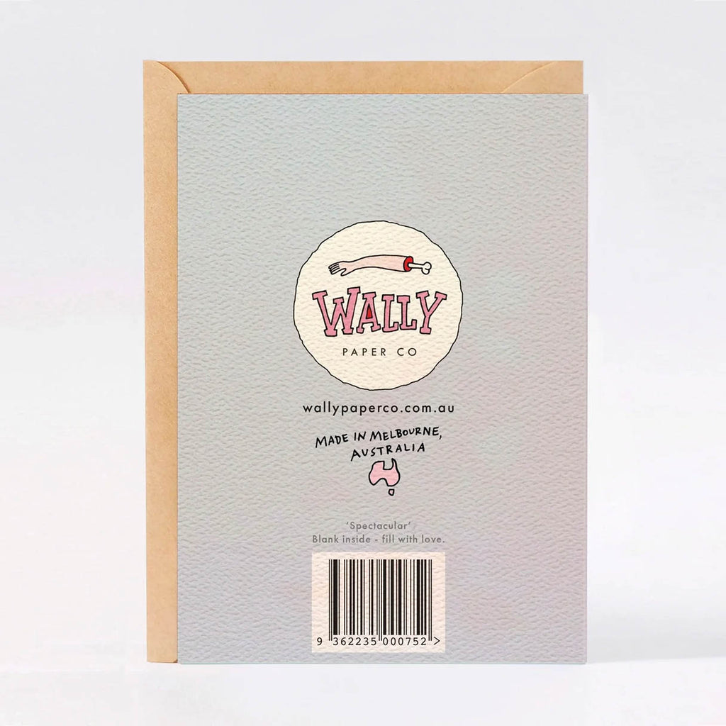 The back of a Wally Paper Co greeting card, shown with a kraft envelope behind it on a light grey background. The card back is pale lilac textured paper with printed branding, a barcode, and small text including 'Made in Melbourne, Australia'.