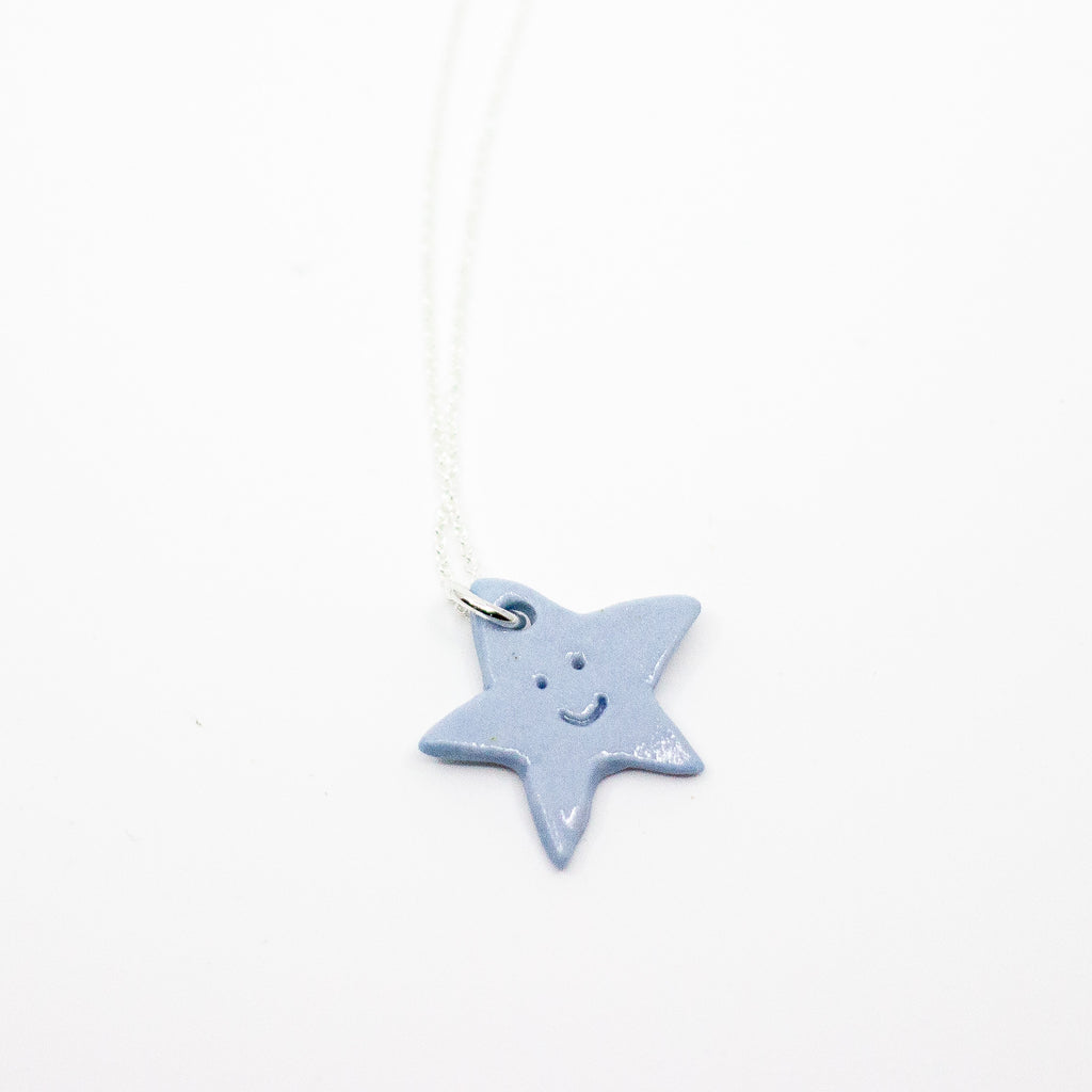 Star-shaped pendant on a white background