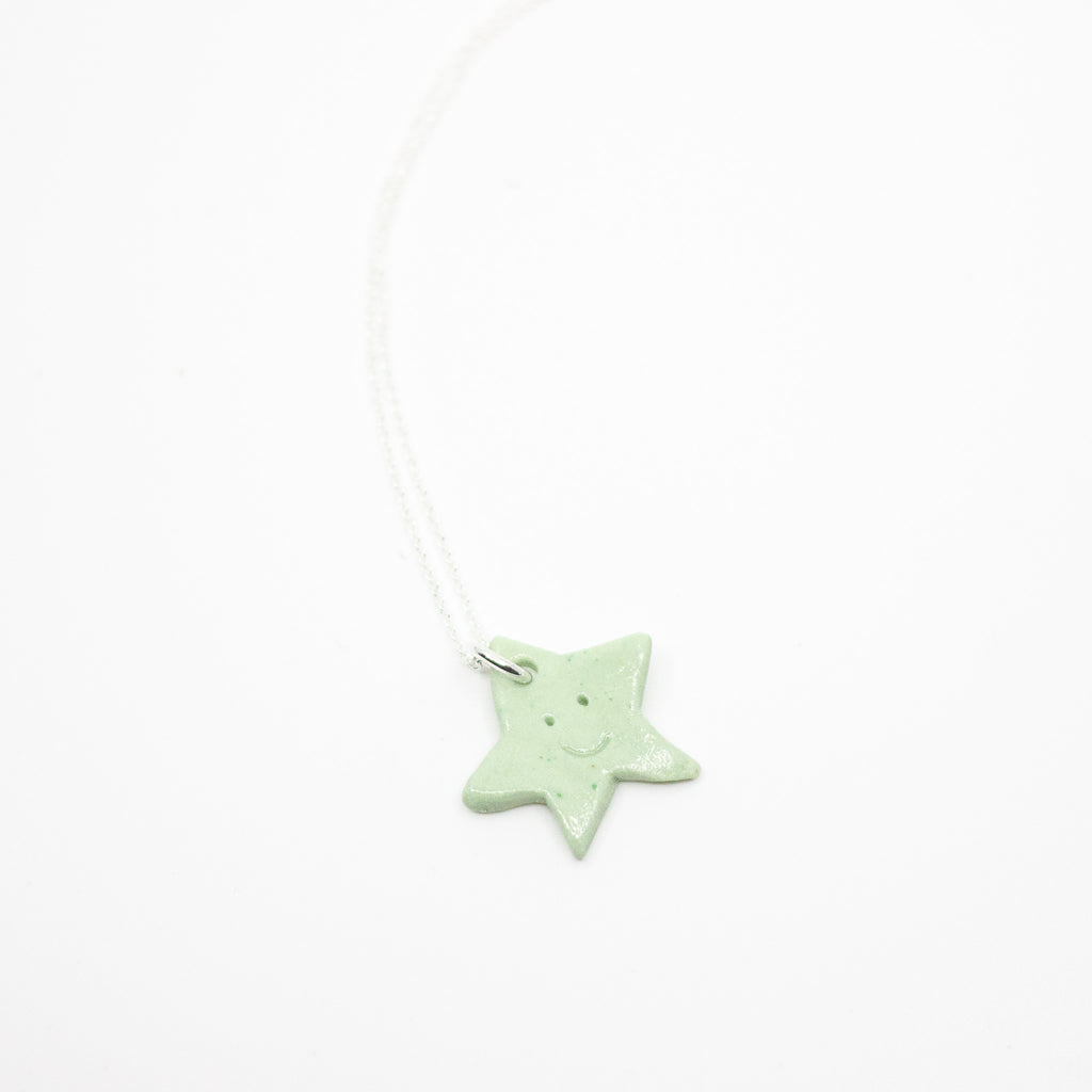 Star-shaped pendant on a white background