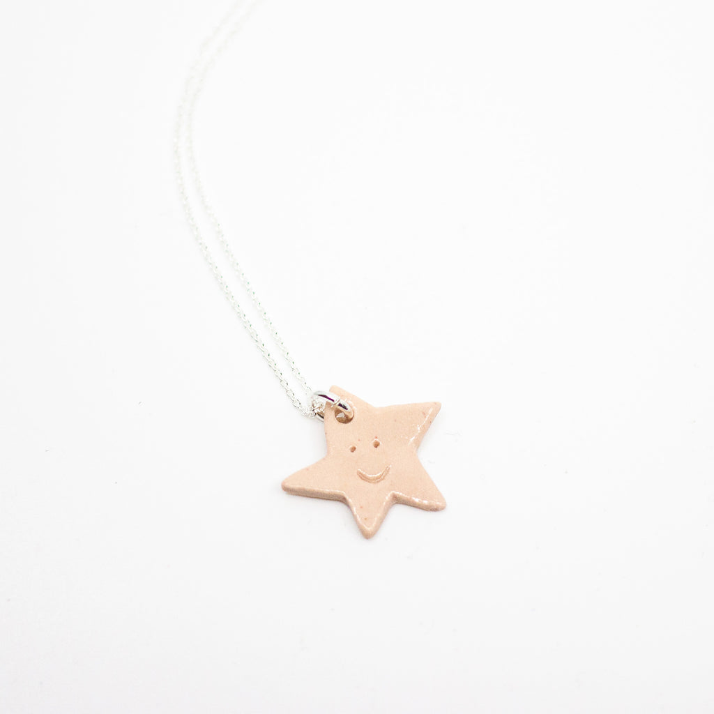 Star-shaped pendant on a white background