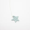 Star-shaped pendant on a white background