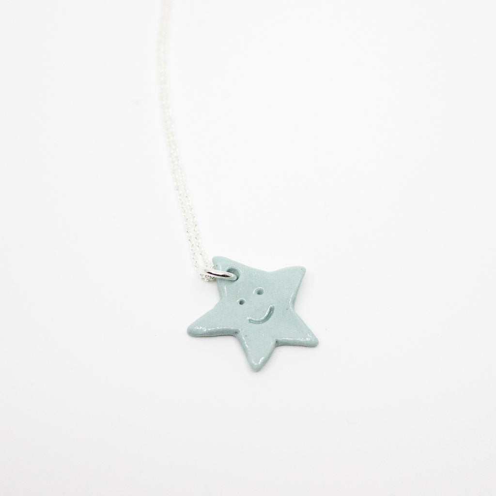 Star-shaped pendant on a white background