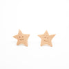 Star-shaped Earrings with smiling faces on a white background