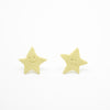 Two yellow star-shaped earrings on a white background