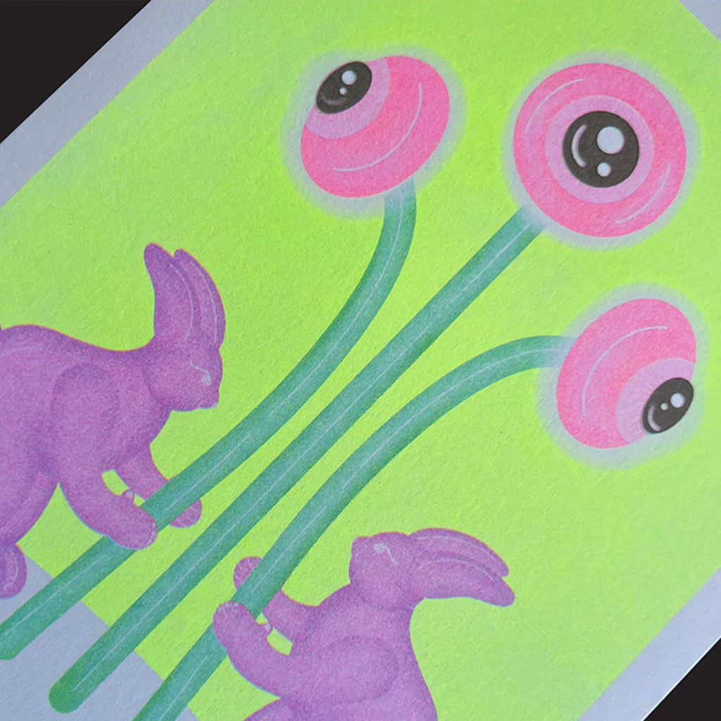 A close-up of a colourful art print or card featuring three purple rabbits and three pink eyeball flowers with green stems on a bright lime green background.