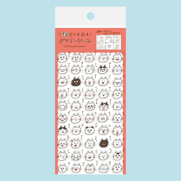 A package of cute cartoon cat face stickers with various expressions, featuring a coral pink border and a white header card, shown against a solid light blue background.