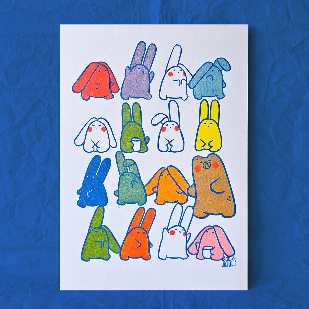 A white art print featuring a grid of colourful cartoon creatures with blue outlines, displayed against a textured blue background.