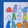 A white art print featuring a grid of colourful cartoon rabbits and creatures with blue outlines, displayed against a textured blue background.